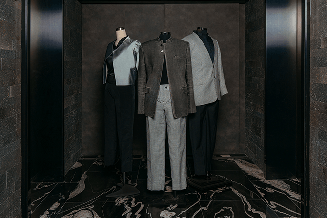 Three uniform designs for The Clan Hotel dressed on mannequins